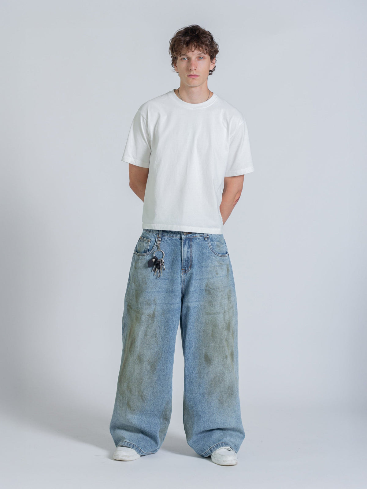 MUD STAINED JEANS - LIGHT BLUE