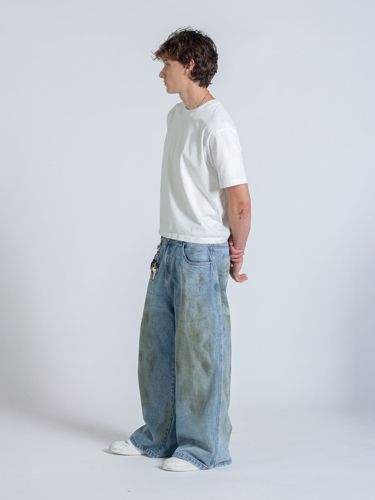 MUD STAINED JEANS - LIGHT BLUE