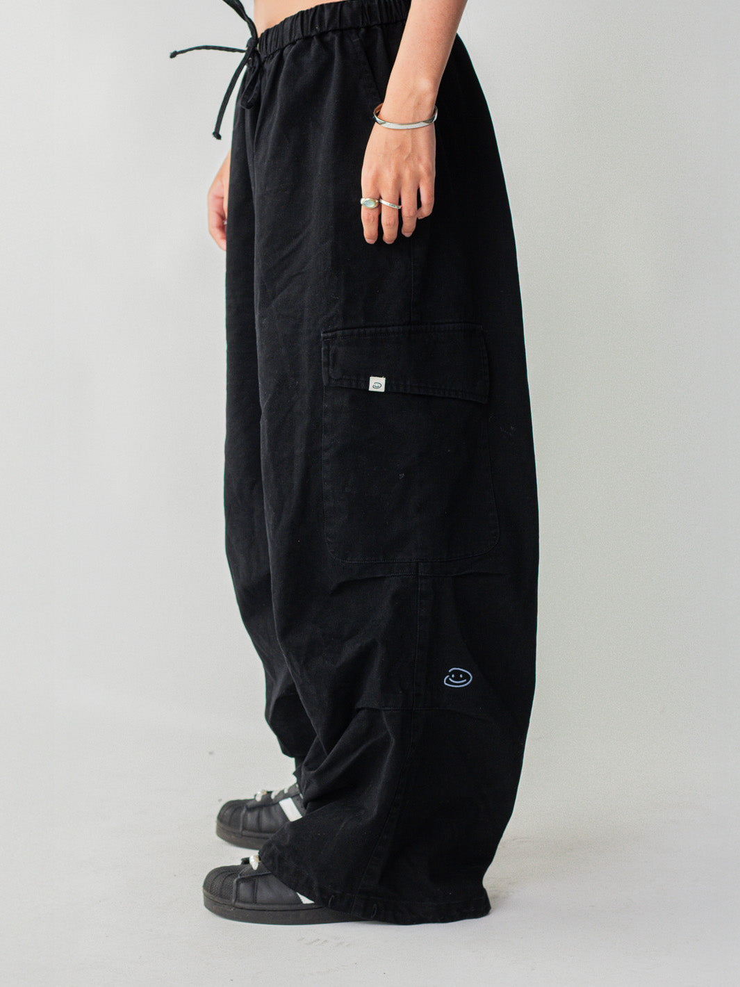 SMILEY LOGO PARACHUTE PANTS - BLACK