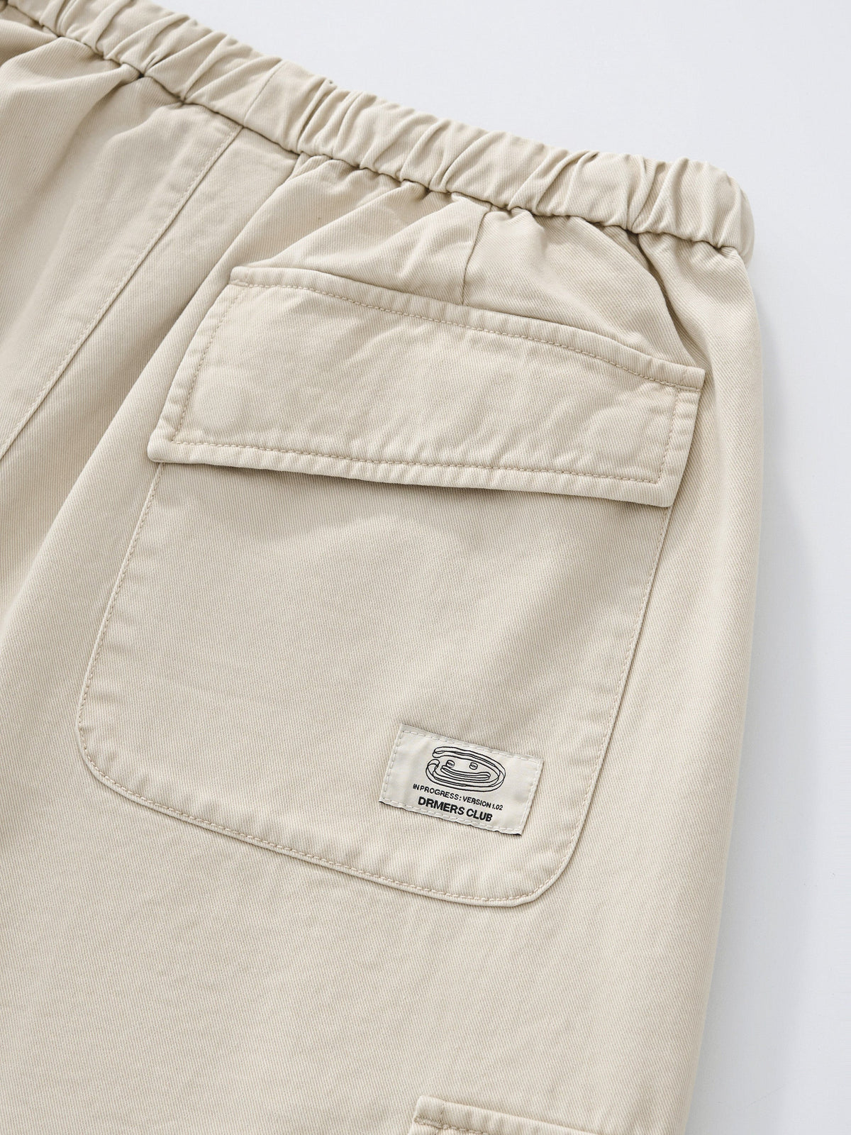 SMILEY LOGO PARACHUTE PANTS - LIGHT BEIGE