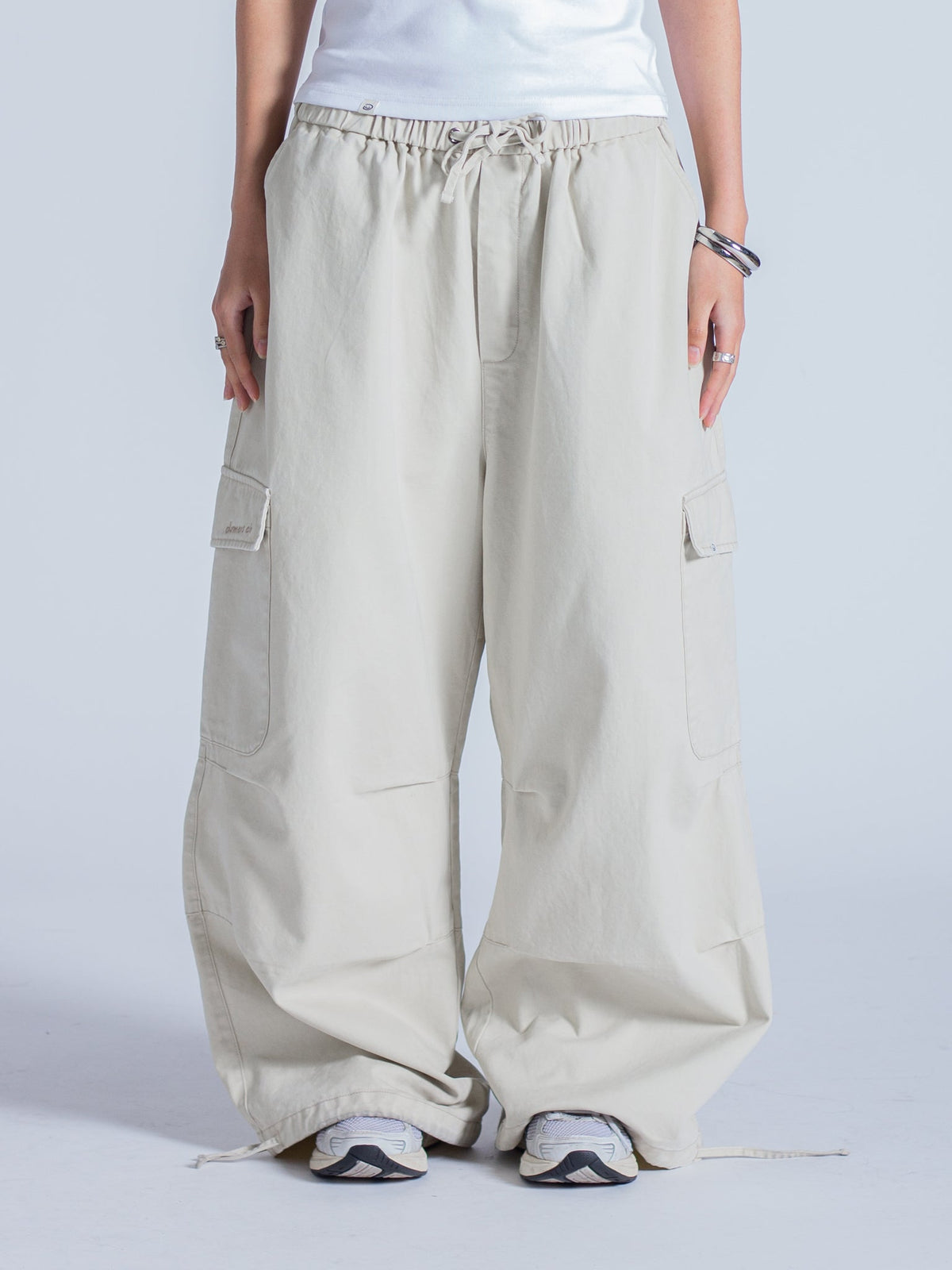 SMILEY LOGO PARACHUTE PANTS - LIGHT BEIGE