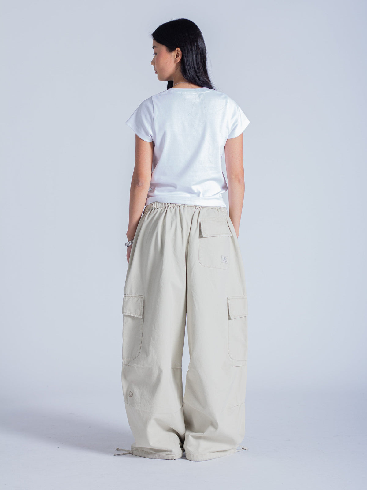 SMILEY LOGO PARACHUTE PANTS - LIGHT BEIGE
