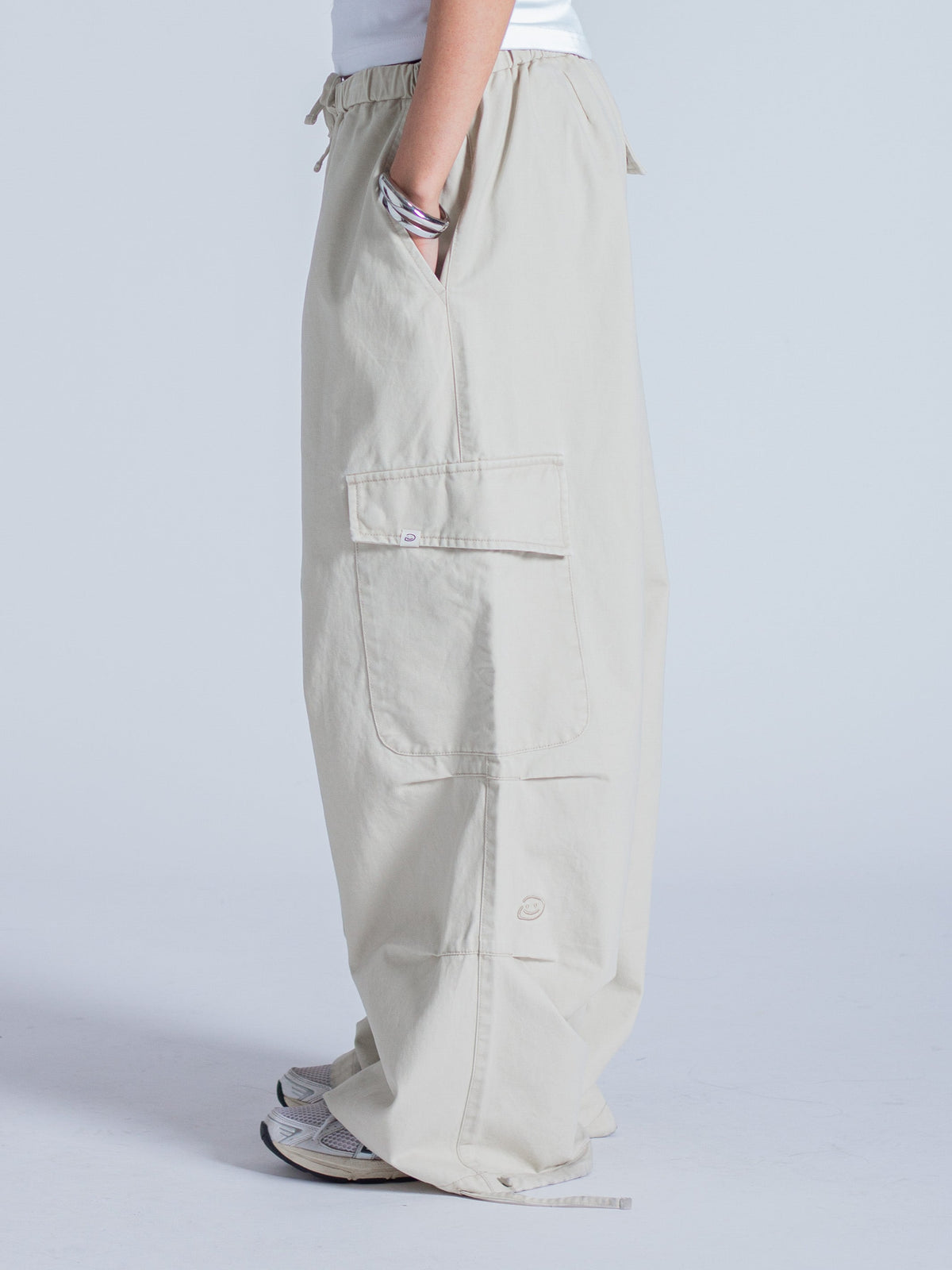 SMILEY LOGO PARACHUTE PANTS - LIGHT BEIGE