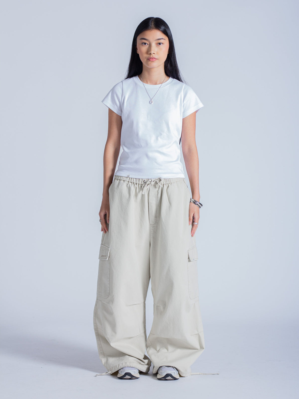 SMILEY LOGO PARACHUTE PANTS - LIGHT BEIGE