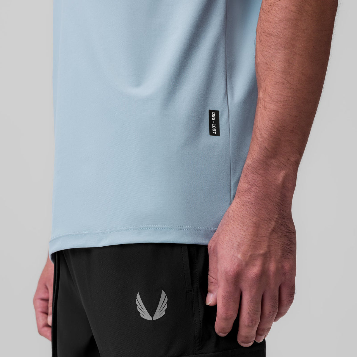 1087. Tetra-Lite® Ice Zip Tee - Light Sky